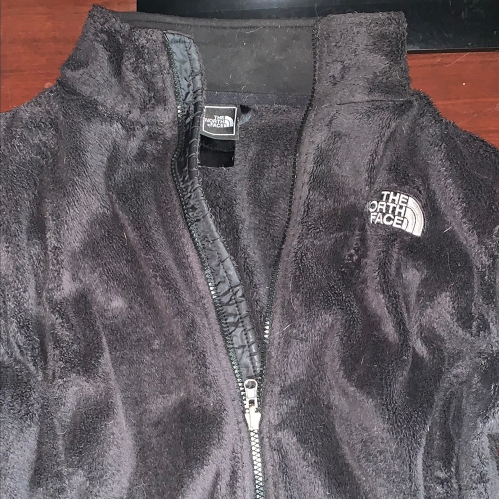 Black zip up north face jacket